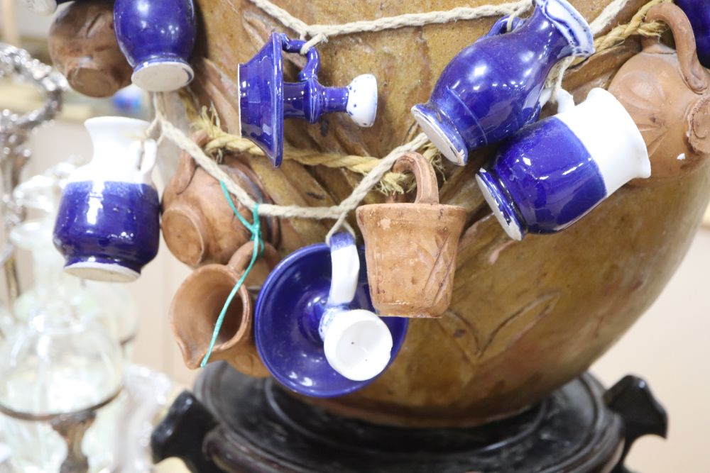 A Chinese straits earthenware matavan and a stoneware vessel on stand